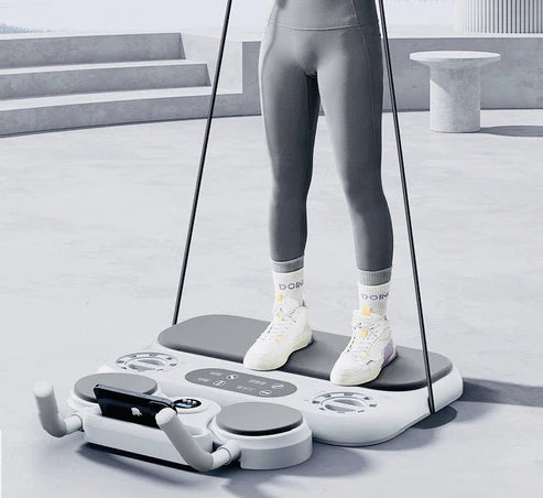 Person using a multifunctional fitness board with resistance bands for a full-body workout in a modern gym setting.